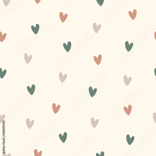 Hand drawn seamless vector pattern of small pastel colored hearts in boho style on a milky background.