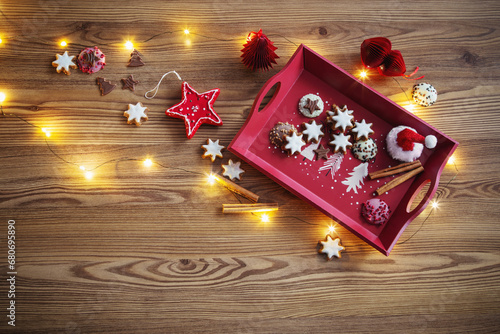 christmas decor and  cookies  with lights on wooden table
