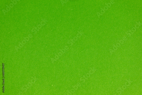 Detail of green colour paper sheet (school poster board, bristol board) texture. Plain background