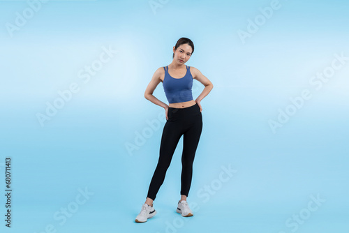 Full body asian woman in sportswear portrait  smiling and posing cheerful gesture. Workout training with attractive girl engage in her pursuit of healthy lifestyle. Isolated background Vigorous