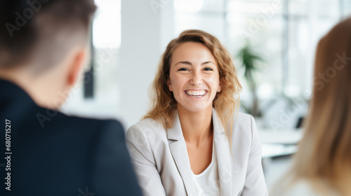 Radiant Businesswoman Smiling with Confidence in Lively Discussion, Office Setting, Professional Workspace