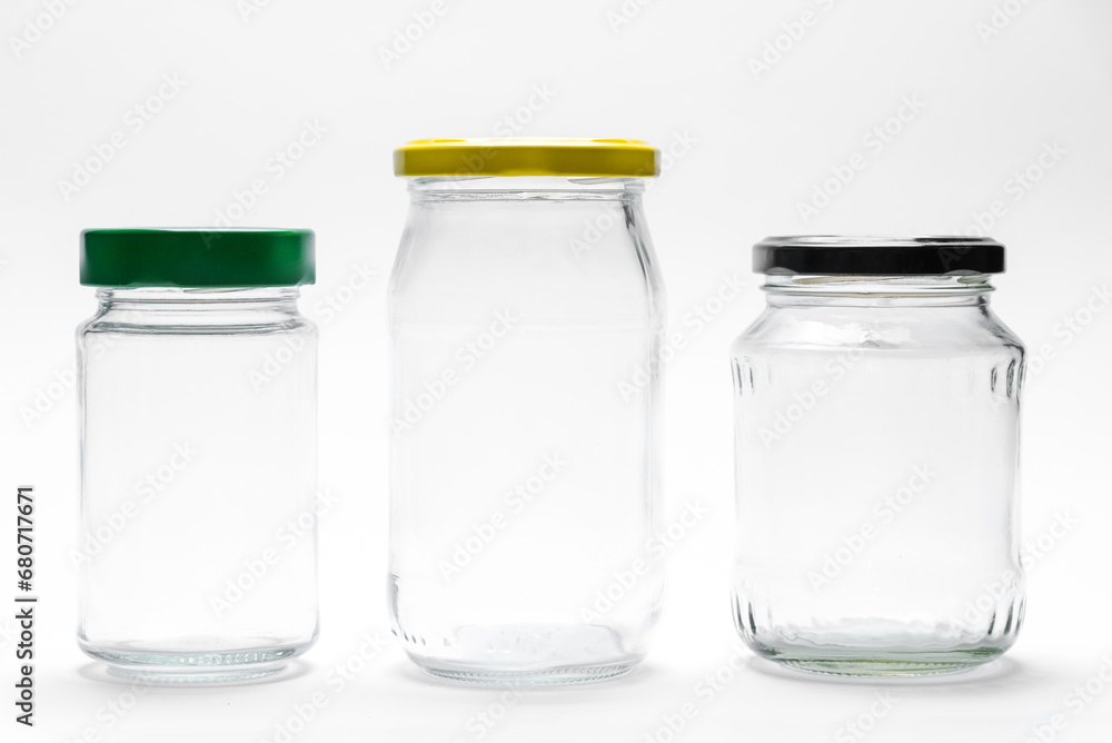 Empty transparent glass jars with lids isolated on white background Empty transparent glass jars with lids isolated on white background