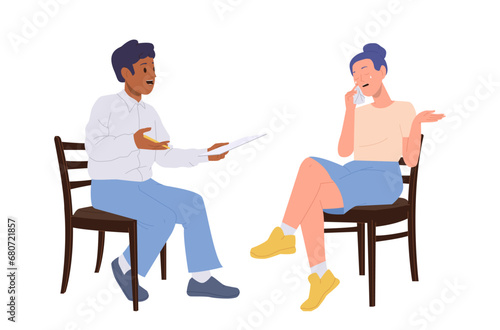 Male psychotherapist talking to crying woman patient during therapy interview session