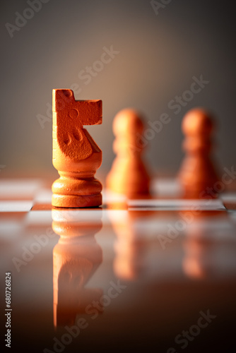 close-up photograph of the horse, a chess piece. Chess is an strategy and intelligence board game. concept of leadership photo