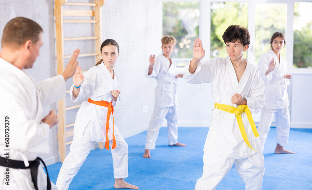 Preteen children during karate training. Martial arts. Active lifestyle concept