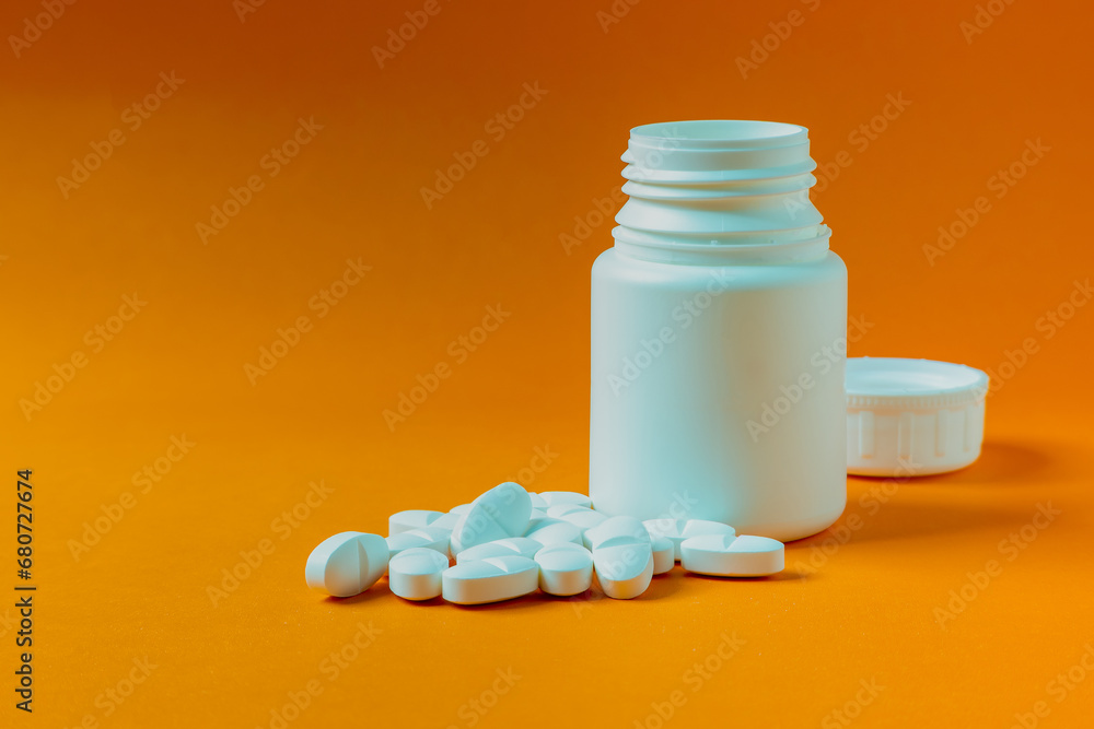 Pill container on an orange background. Pill container on an orange background.