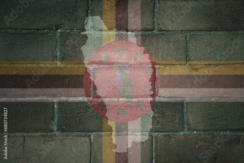 map and flag of dominica on a old brick wall