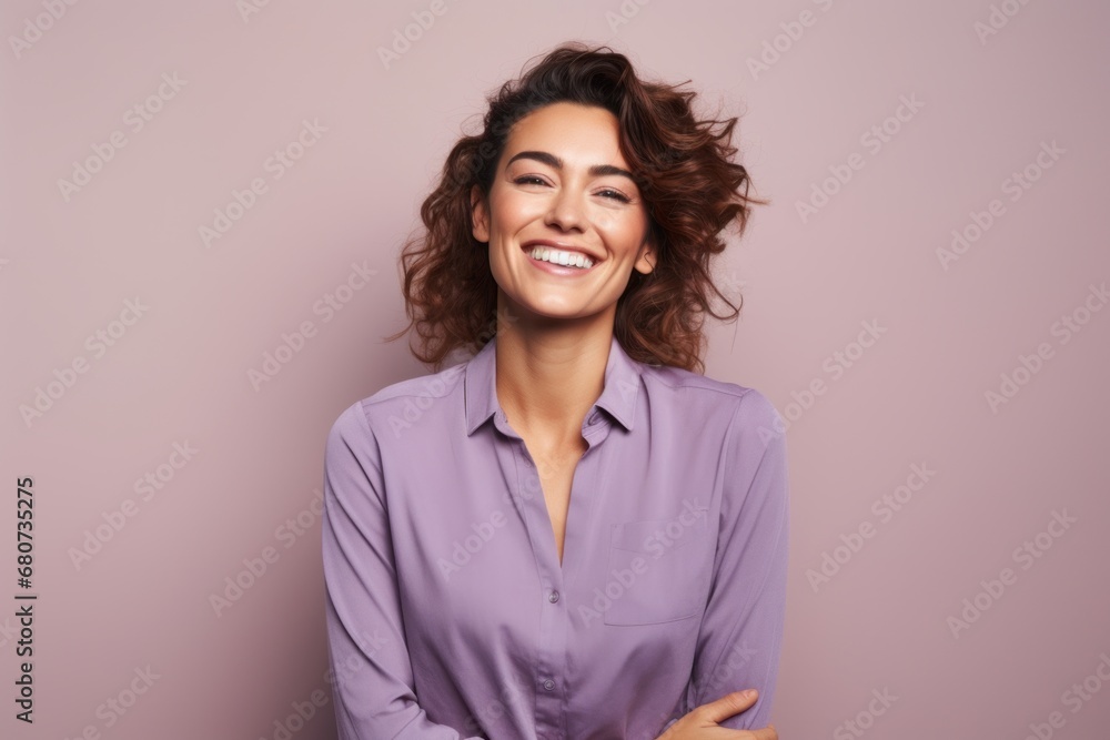 Portrait of a smiling young business woman standing against pink background. Portrait of a smiling young business woman standing against pink background.