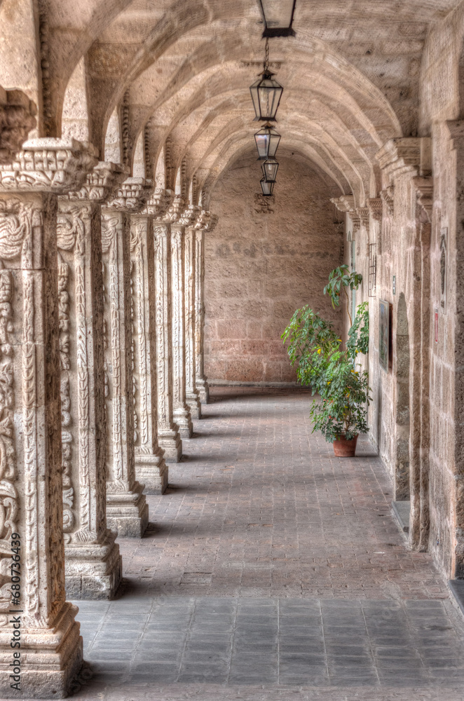 Perspective of carved columns in the Cloister of the La Compania Church, Arequipa, Peru. 17th century. HDR