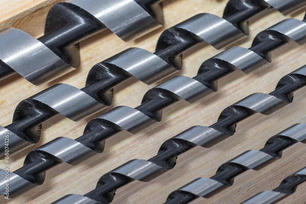 Spiral wood drill bits closeup. Building tools as background - obrazy, fototapety, plakaty 