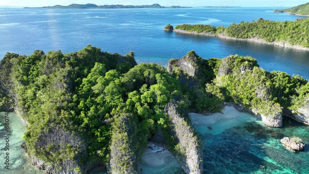 The incredibly scenic, limestone islands of Penemu are surrounded by beautiful coral reefs. These islands, found in northern Raja Ampat, support an amazing array of biodiversity. The incredibly scenic, limestone islands of Penemu are surrounded by beautiful coral reefs. These islands, found in northern Raja Ampat, support an amazing array of biodiversity.