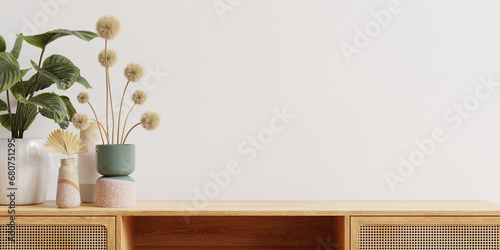 Wooden cabinet and accessories decor in living room interior on empty white wall background