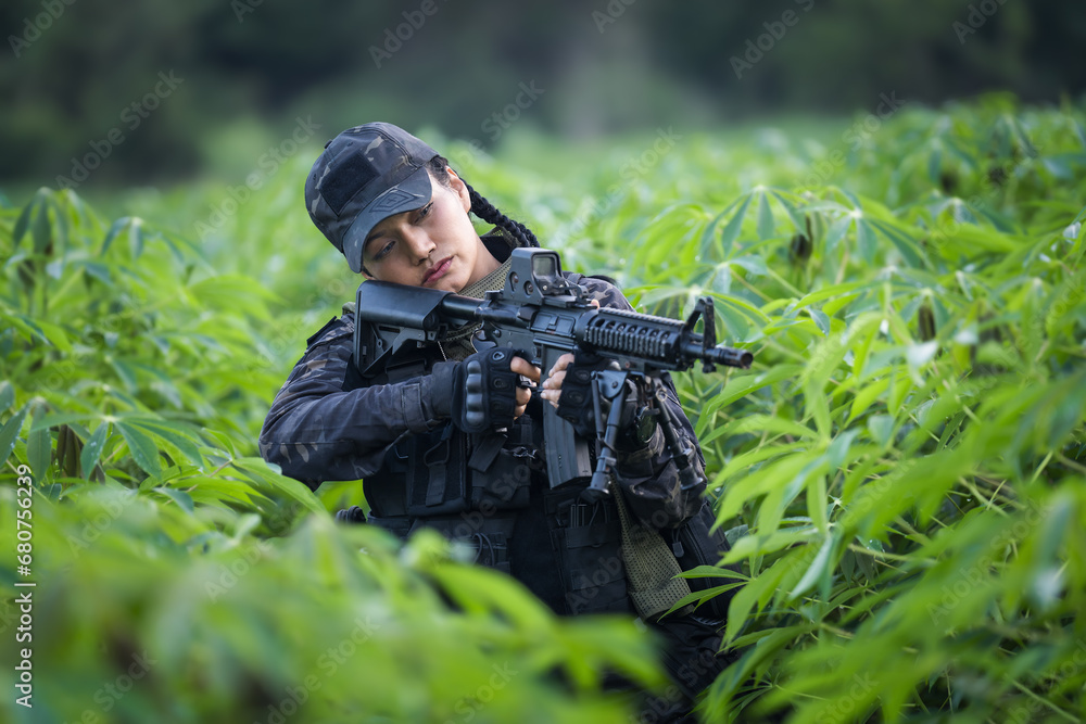 Thai female soldier engaging in precision rifle training in the field