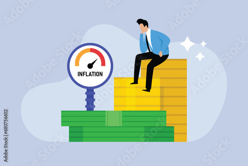 Businessman thinking of high inflation while sitting on a stack of coins