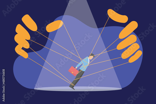 Hands manipulating and controlling businessman with strings