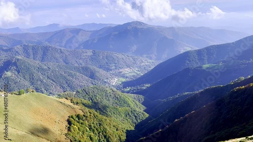 Mountain Train with Window View on the Autumn Forest and Mountainscape and Mountain Valley in a Sunny Day with Clouds in Valley Muggio in Monte Generoso, Ticino, Switzerland, Europe photo