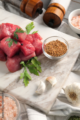 Raw beef meat and different ingredients for cooking delicious goulash on table
