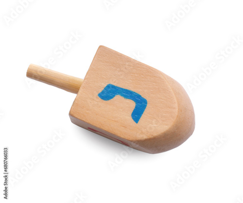 Wooden dreidel isolated on white, above view. Traditional Hanukkah game photo