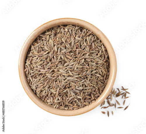 Bowl of aromatic caraway (Persian cumin) seeds isolated on white, top view