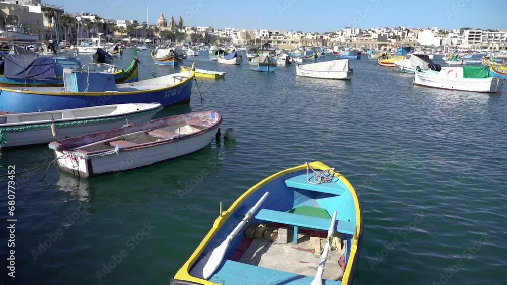 Boat. There are many colorful fishing boats in the port. Malta. Boat. There are many colorful fishing boats in the port. Malta.