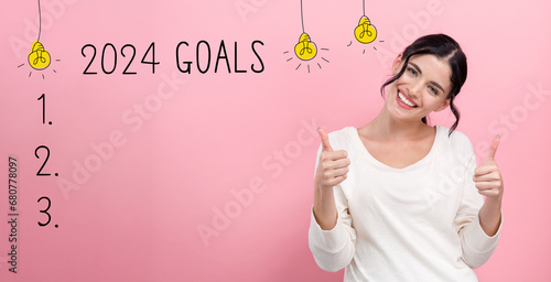 2024 goals with happy young woman giving thumbs up