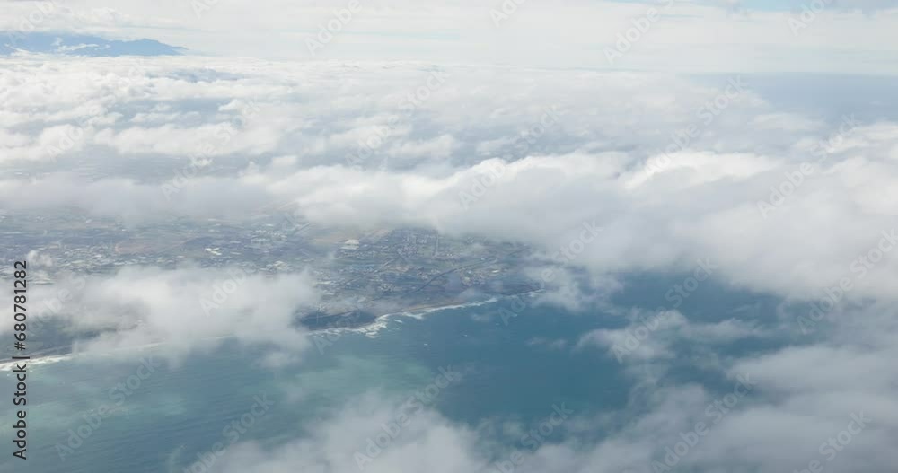Aerial view of the city on the cloud inside the airplane Aerial view of the city on the cloud inside the airplane