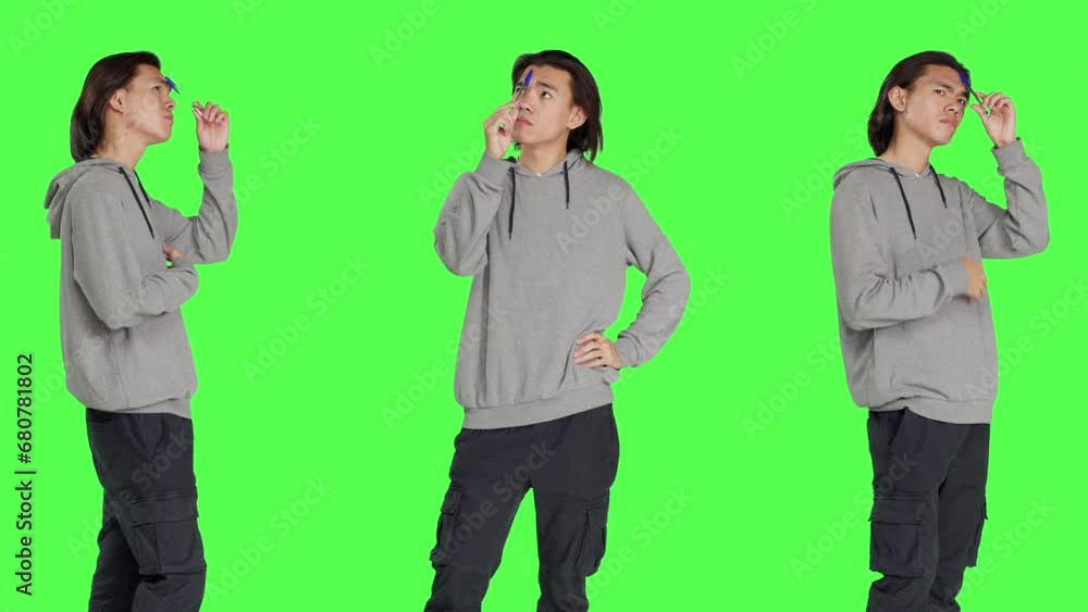 Male thinker acting confused on camera, thinking about question and putting his focus on new perspective. Person being uncertain and pensive, pondering solution over greenscreen. Male thinker acting confused on camera, thinking about question and putting his focus on new perspective. Person being uncertain and pensive, pondering solution over greenscreen.