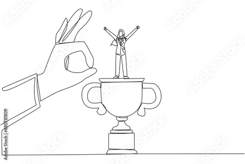 Single continuous line drawing businesswoman standing on big trophy. Celebrating the success of the business. Got fraudulent business opponents. Falling helpless. One line design vector illustration