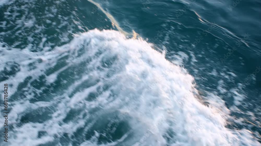 Slow motion view of the wave beside a ship at sea from high angle view Slow motion view of the wave beside a ship at sea from high angle view