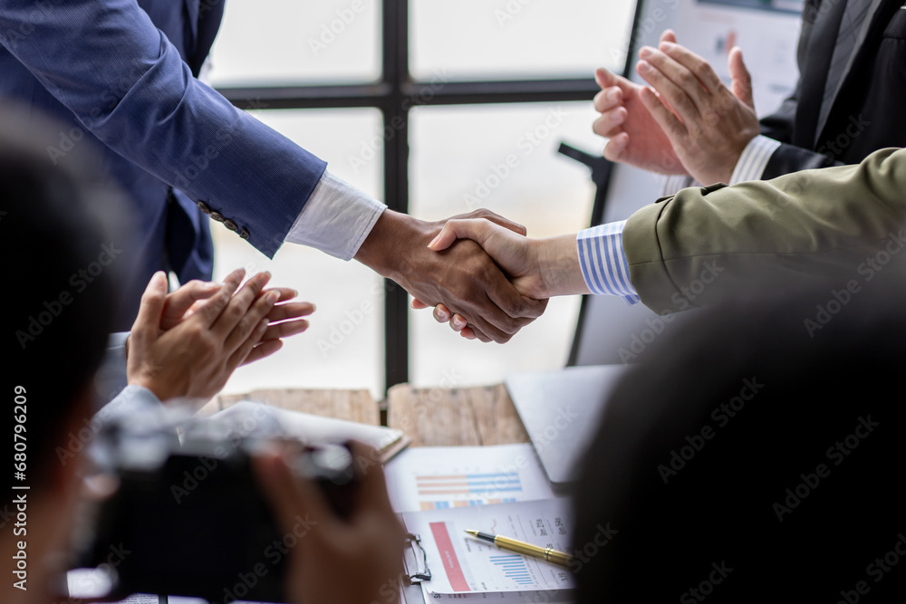 Business Team offer and give hand for handshake in office. Successful job interview. Apply for loan in bank. Salesman, bank worker or lawyer shake for deal, agreement or sale. Increase of salary. Business Team offer and give hand for handshake in office. Successful job interview. Apply for loan in bank. Salesman, bank worker or lawyer shake for deal, agreement or sale. Increase of salary.