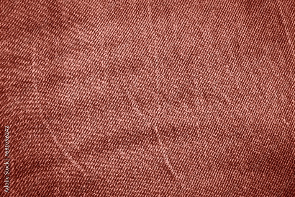 Fototapeta premium Texture of crumpled red jeans. 