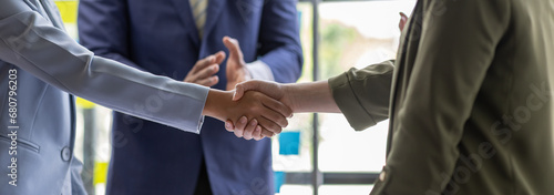 Business Team offer and give hand for handshake in office. Successful job interview. Apply for loan in bank. Salesman, bank worker or lawyer shake for deal, agreement or sale. Increase of salary.	 photo