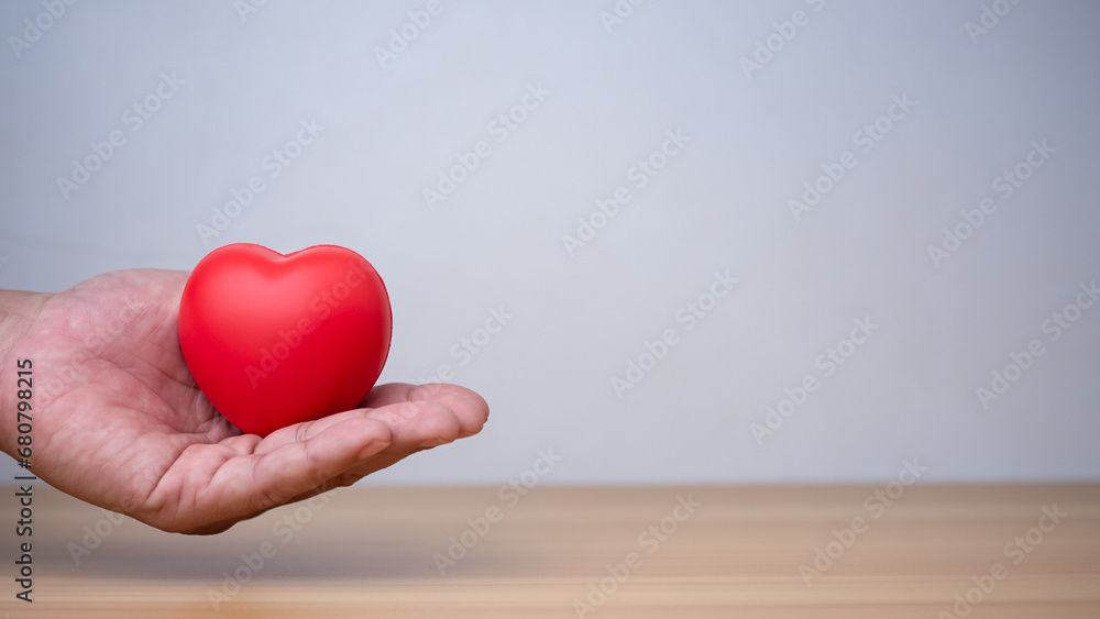 Fototapeta premium Good health and insurance concept, health insurance concept. Human hand holding red heart.