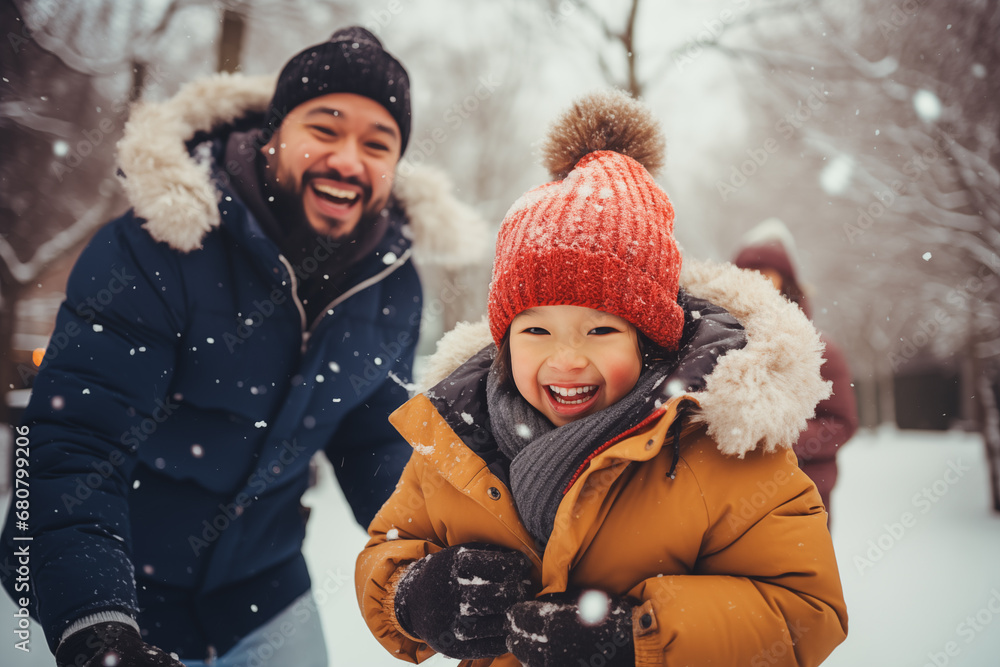 delighted family having fun, playing outdoor in snow. winter season activity delighted family having fun, playing outdoor in snow. winter season activity