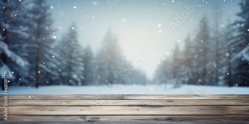 Wooden table for present product on snowy forest blur background. Christmas background for product montage.