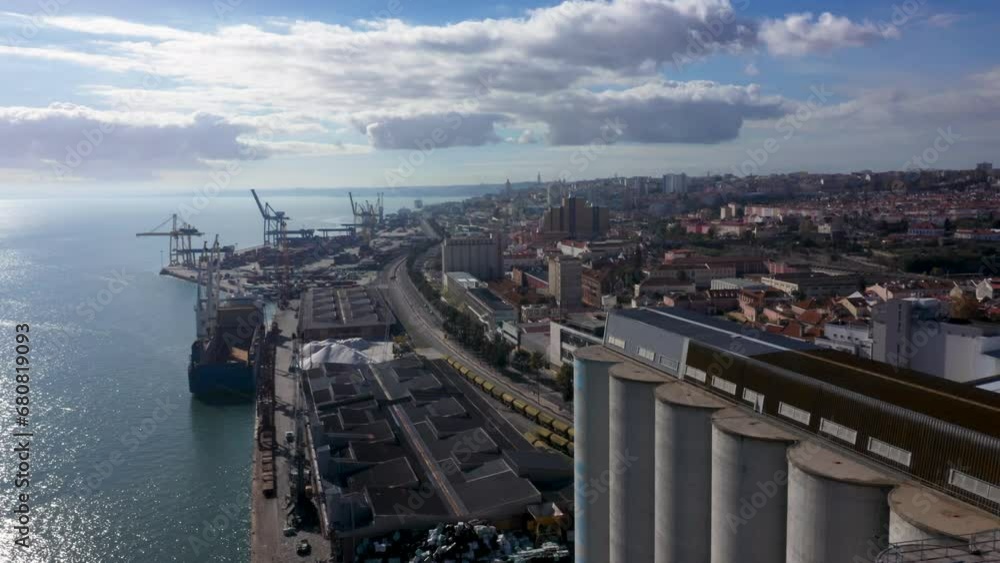 Waterfront City And Industrial Port Of Lisbon In Portugal. Aerial Shot Waterfront City And Industrial Port Of Lisbon In Portugal. Aerial Shot