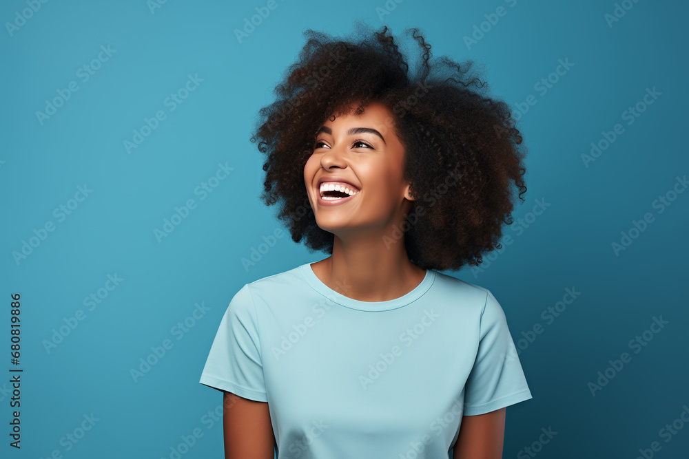portrait of happy african american woman on blue background portrait of happy african american woman on blue background