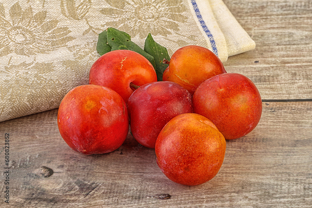 Red juicy raw plum heap Red juicy raw plum heap