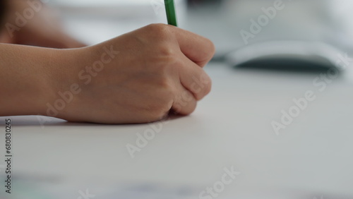 Designer fingers drawing paper table closeup. Creator hands working blueprints