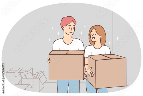 Happy couple with boxes relocating