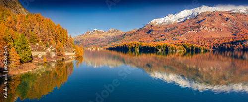 Panoramic autumn view of Sils Lake. colorful morning view of Swiss Alps, Maloja Region, Upper Engadine, Switzerpand, Europe. Beauty of nature concept background. photo