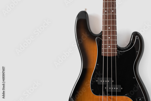 Black bass guitar on white background. Musical instrument