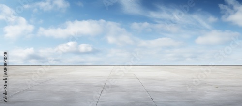 Empty concrete floor for outdoor car parking with blue sky. AI generated image photo