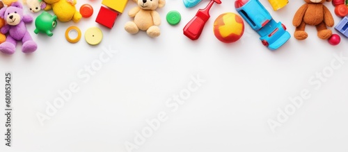 Top view of white paper copy space background with various toys and drawing tools