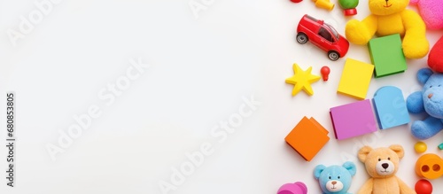 White paper copy space background with various colorful toys and drawing tools