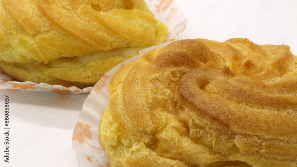 Two traditional cake Cream puffs Two traditional cake Cream puffs