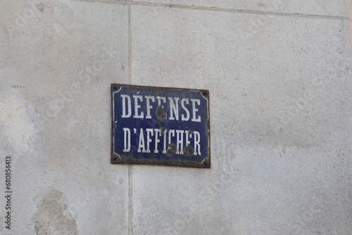 Prohibition to display text board sign on facade wall called defense d'afficher in French language