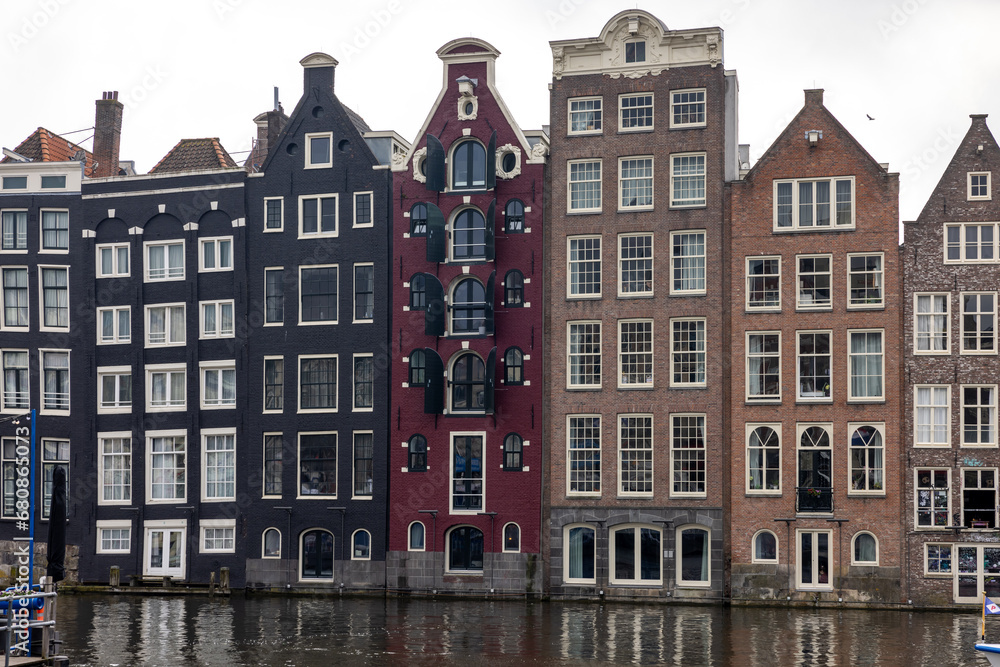 Typical gabled houses on Damrak street in Amsterdam, Holland, Netherlands