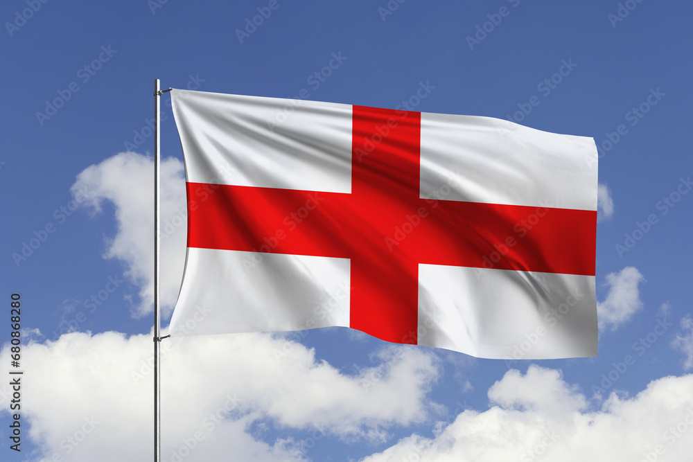 Obraz premium England flag fluttering in the wind on sky.