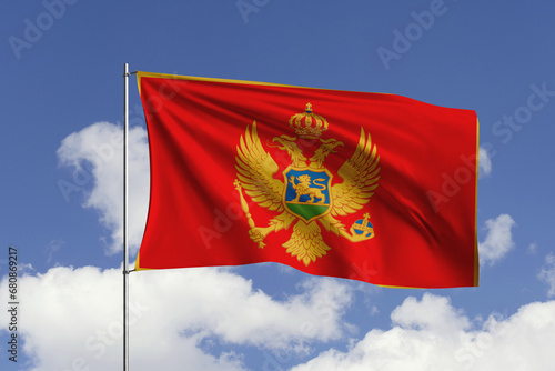 Montenegro flag fluttering in the wind on sky.